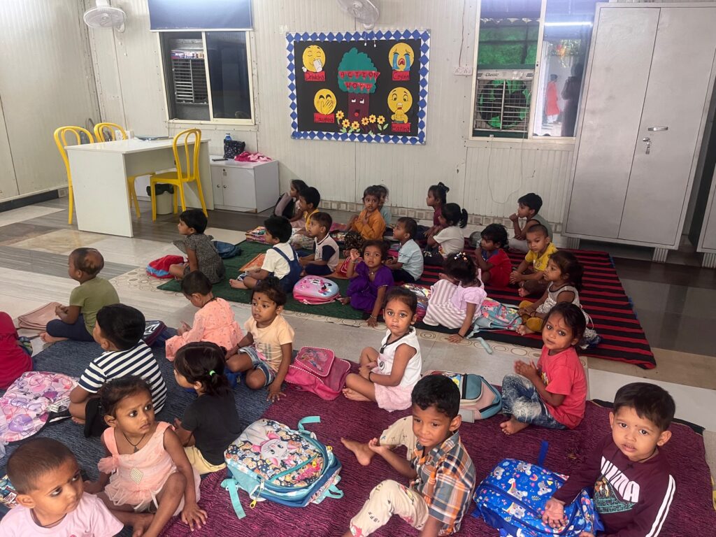 Distribution of play and study material to neighbourhood day care centre for working mothers who are daily wagers and low income employees.